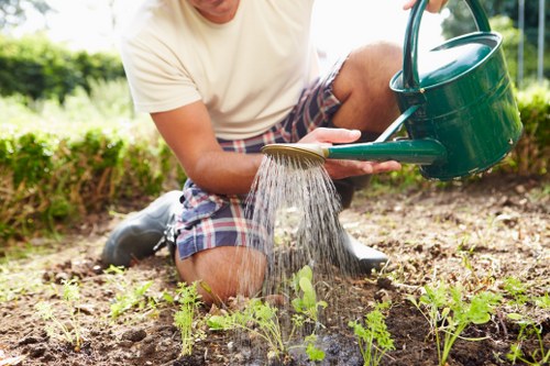 Landscaping team working safely with waste removal equipment